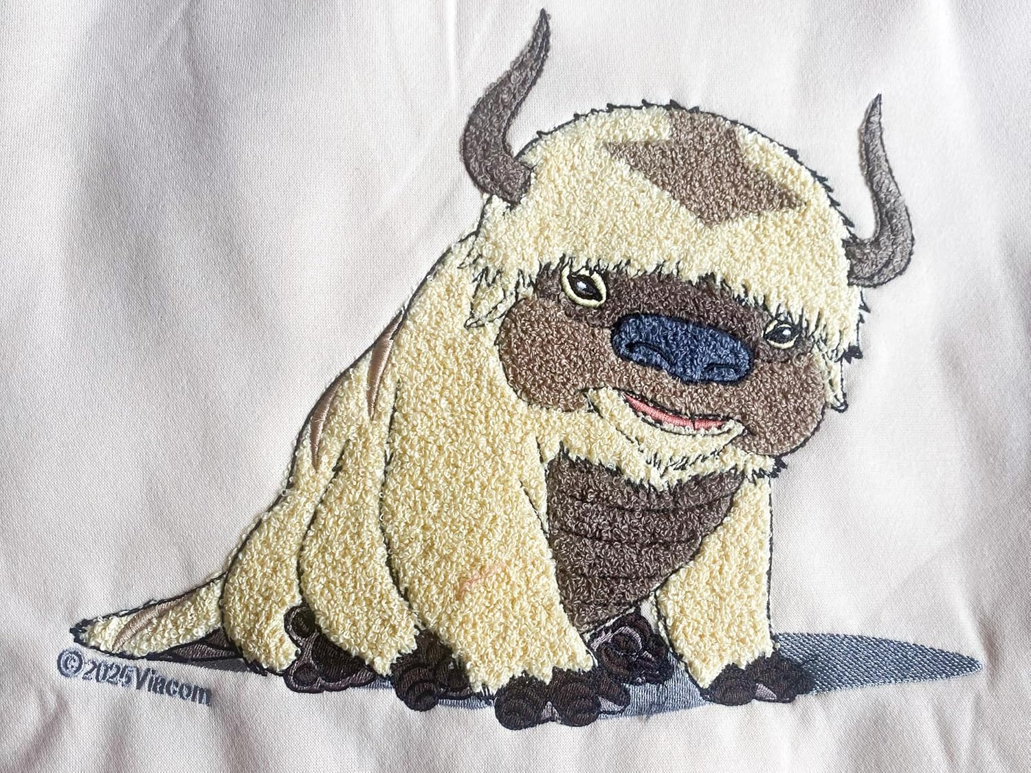 Avatar: The Last Airbender Appa Chenille Hoodie – “Yip Yip!” Back, Four Nations Sleeve Icons, Unisex Sweatshirt (Size Small) Tan - Image 2